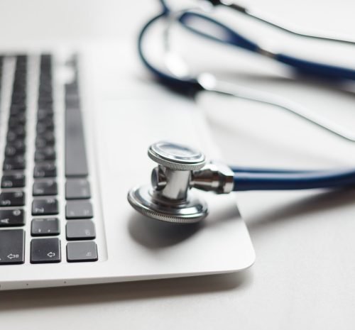 Stethoscope on the laptop keyboard. Medicine concept